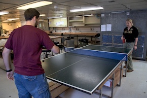Matt on break, playing ping-pong with Dr. Oakley.