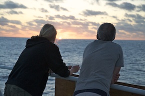 Adrienne and AB Brian Clampitt stand by the railing in the last of the sun's warmth.