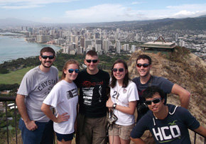 Matt, Jen, Tom, Dani, Nick, and Sam standing at the top of diamond head crater.