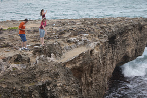 Dr. Oakley points out the shapes of lithified sand dune on a windblown point near the ocean.